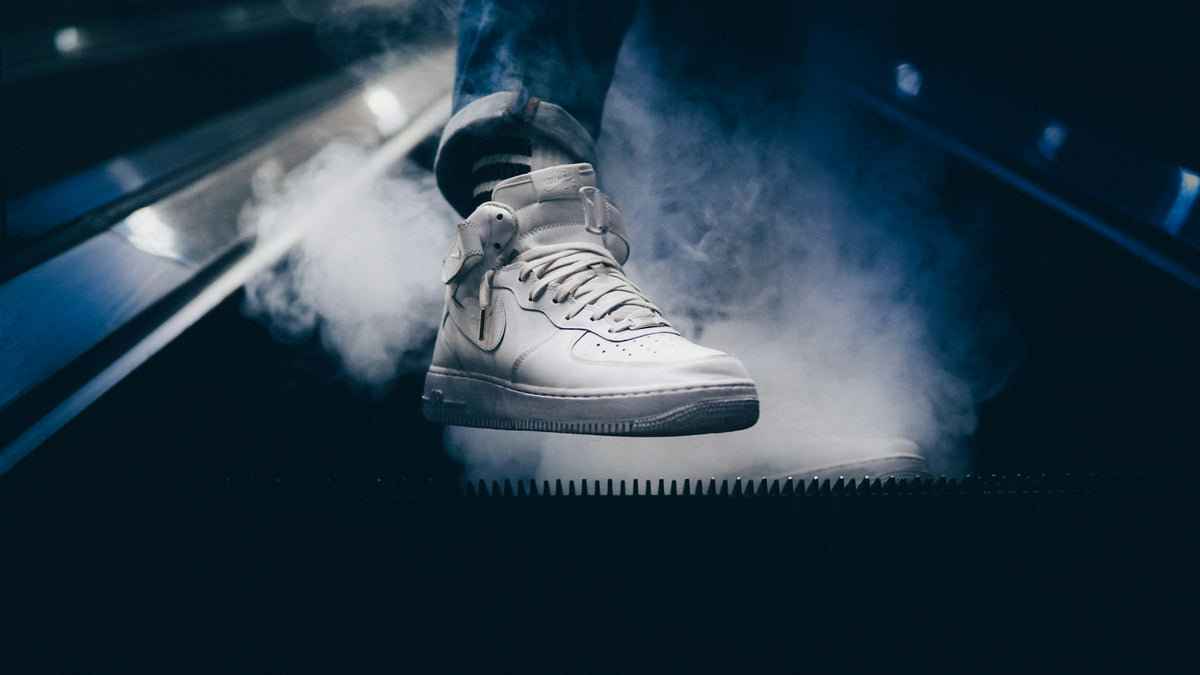 White sneakers on an escalator