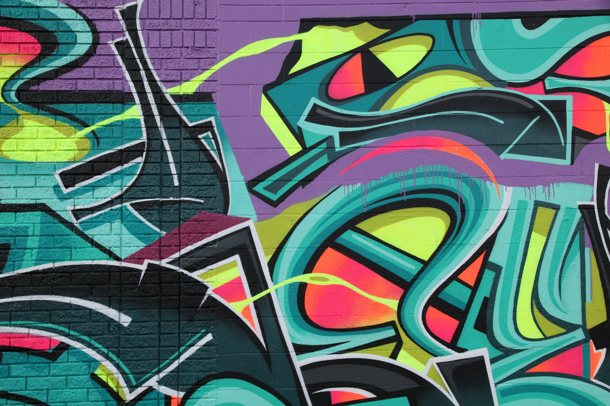 Neon graffiti on a brick wall